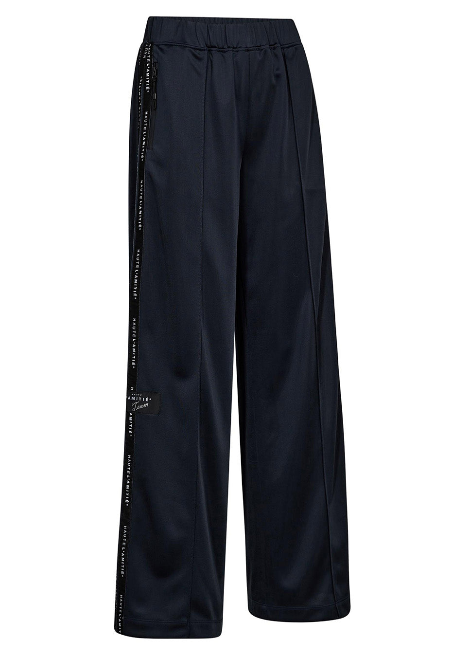 Haute L’Amitié Logo tape track tall pants navy blauw zijkant